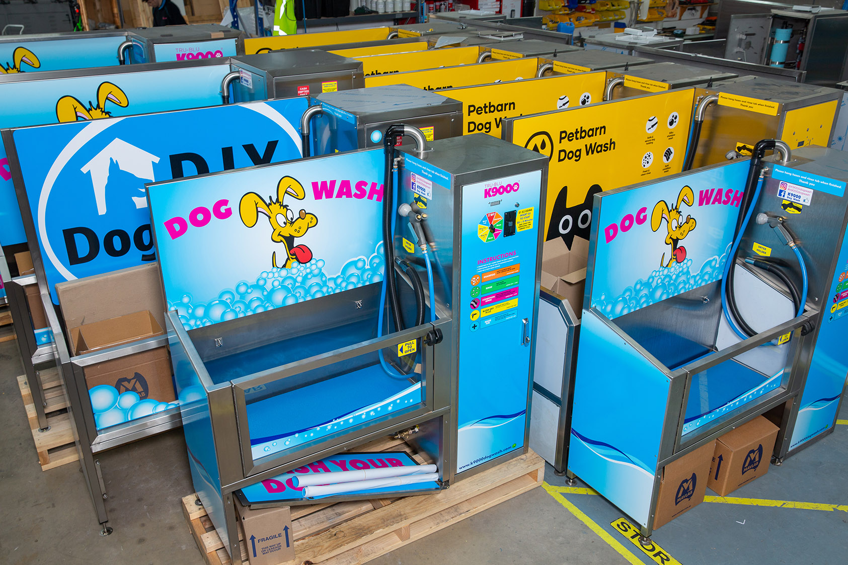 Warehouse of newly made K9000 dog wash machines